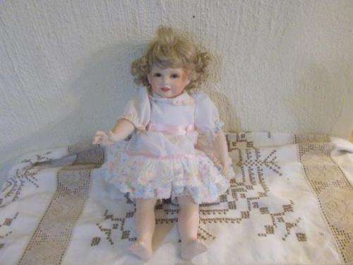 To cute small porcelain doll