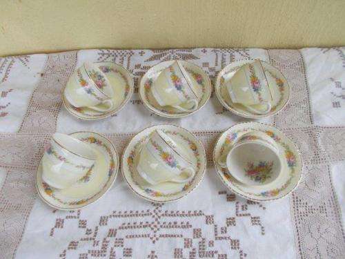 A set of six small demitasse johnson brothers coffee cups and saucers