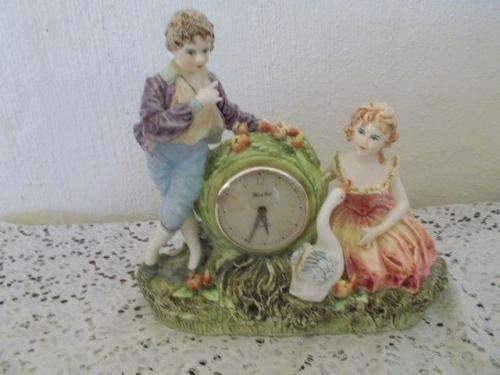 Stunning figurine with vintage wind up clock , clock not working