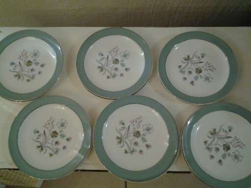 A set of 12 midwinter cake side plates