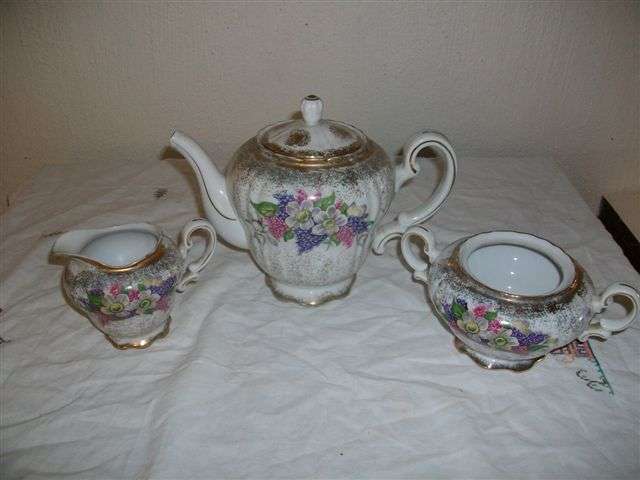 Lovely creamer and sugar bowl , tea pot damaged please note pictures