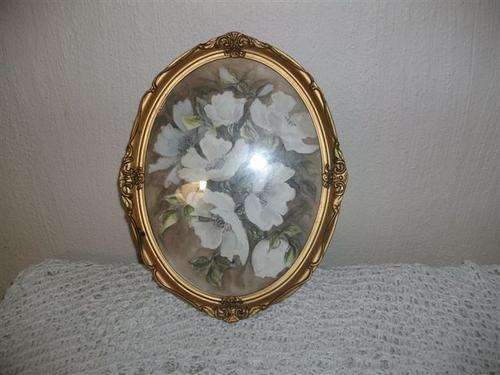 Lovely orante oval frame with a water colour...?? picture of flowers
