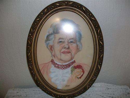 Lovely vintage oval gilded frame with portrait of grandma