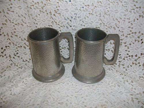 two pewter mugs , perfect for you're bar