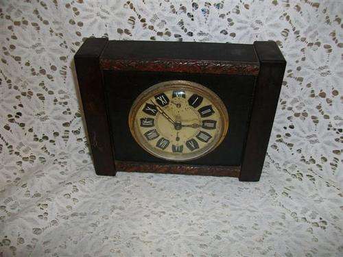 Small wooden wind up mantel clock , peter