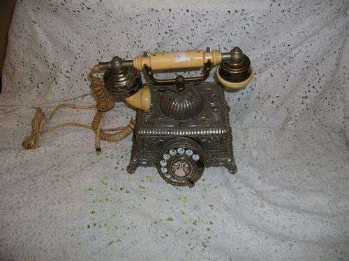 antique style ornate metal phone