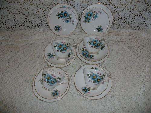 Pretty blue flowers tea cup trio's with extra saucers and side plates