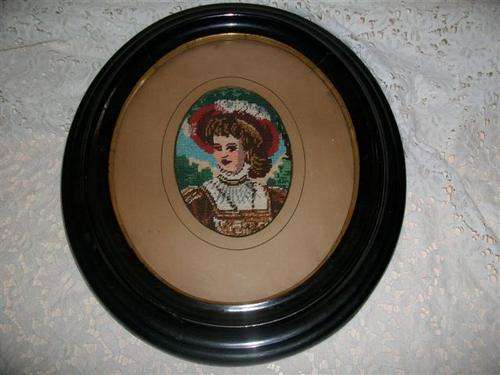 Black oval vintage frame with a lady tapestry simply lovely