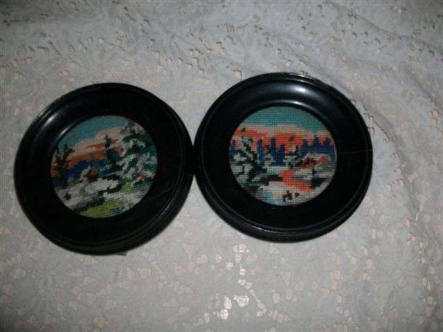 Two small round black vintage frames with tapestry's