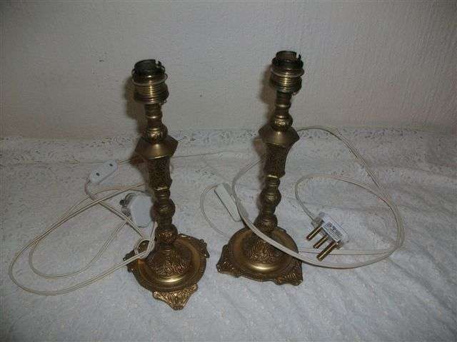 Two ornate brass..?? lamp stands