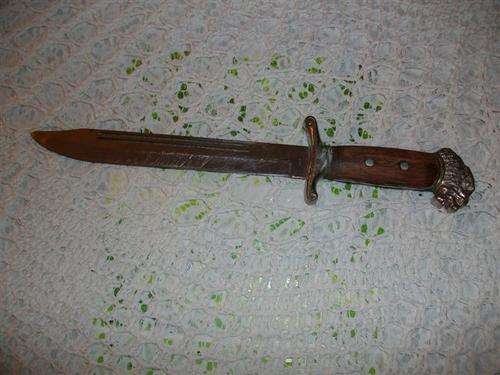 Large knife with wooden handle and lion head