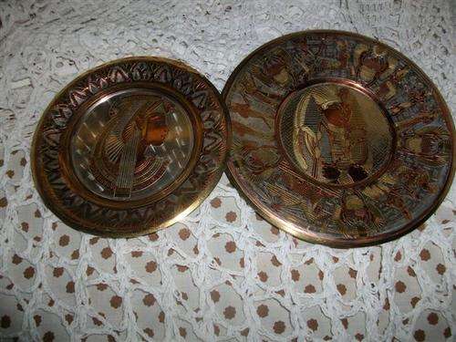 Two small egyptian style wall plates
