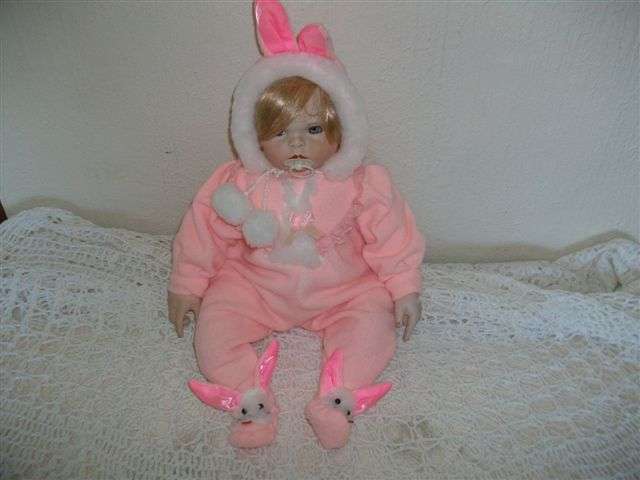 Bisque baby doll dressed in a rabbit out fit lovely !!