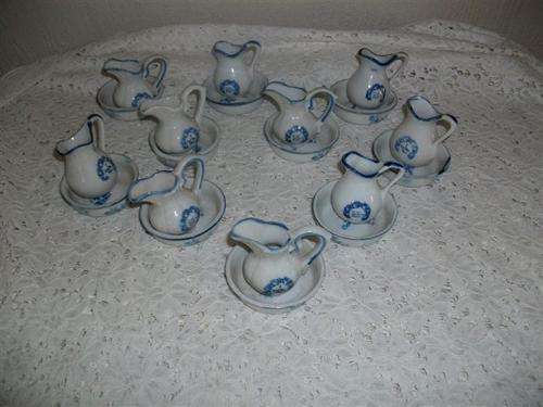 Collection of small blue and white basin and jugs sets