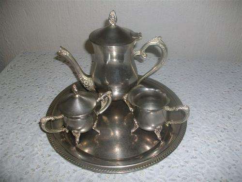 small sliver plated ornate tea set on tray ,