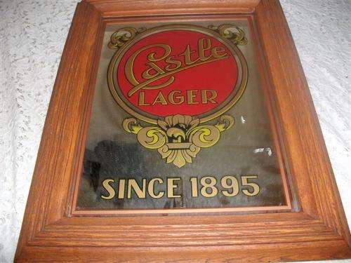 wooden framed med sized castle lager bar mirror