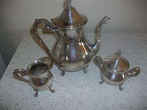 Ornate sliver plated three peace tea set some damage noted please view