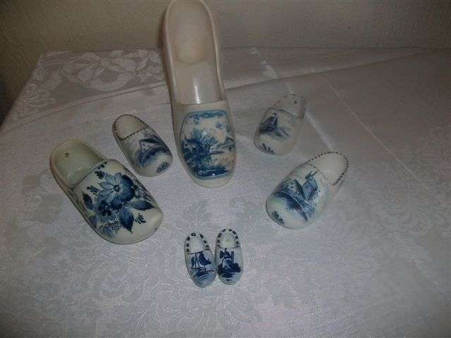 Assorted collection of blue and white shoes some are delft