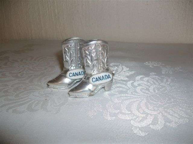 A pair of silver chrome plated salt and pepper cowboy boots