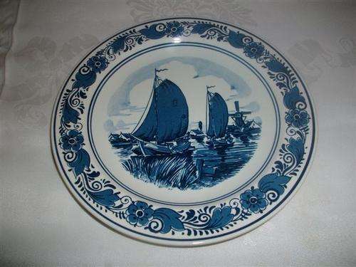 Collectable blue and white boating scene delft wall plate