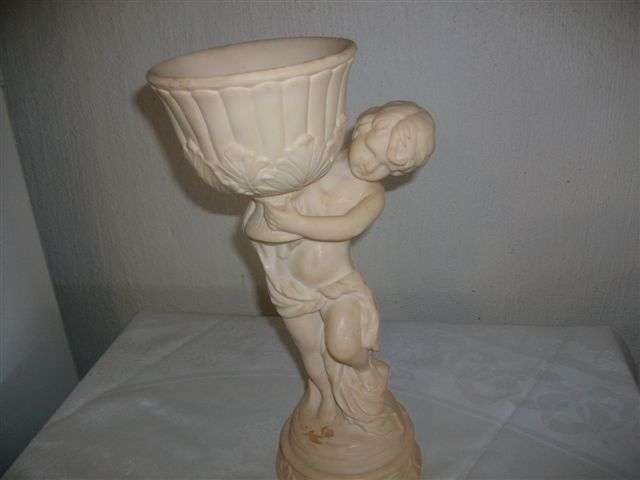 Large cherub holding a pot resin figurine