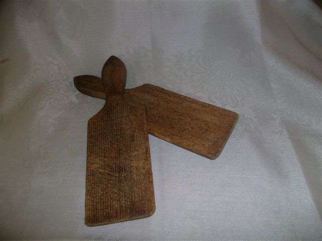 A pair of wooden vinage butter boards