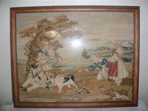 Vintage framed romatic scence taperstry behind glass