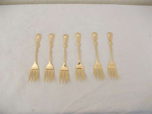 Five lovely gold plated cake forks
