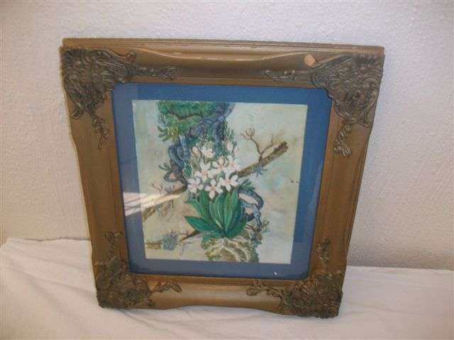 Gorgeous vintage frame with a print of flowers behind glass