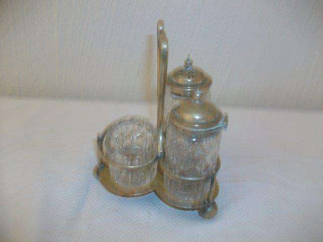 Lovely glass cruet set on a sliver plated stand