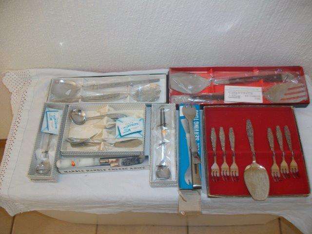 Large lot assorted selection of stainless steel boxed cultery items cake set etc