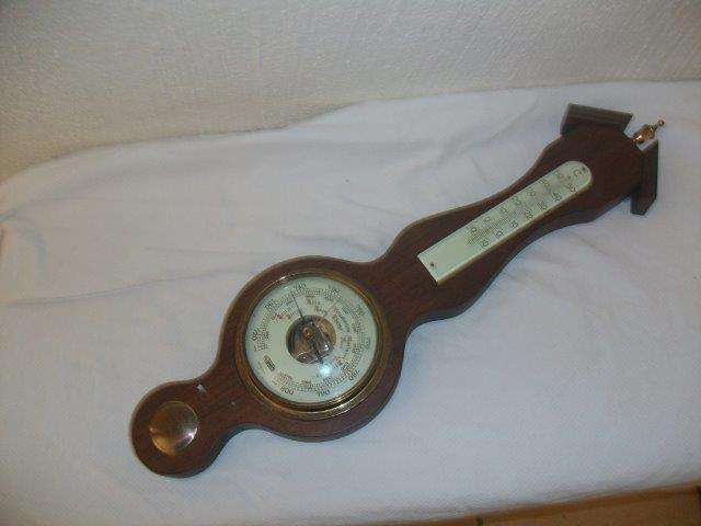 Wooden vintage barometer and thermometer