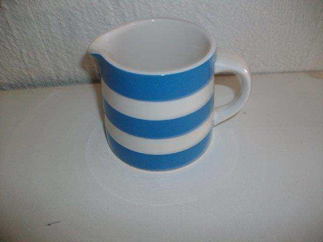 Blue and white corning wear milk jug