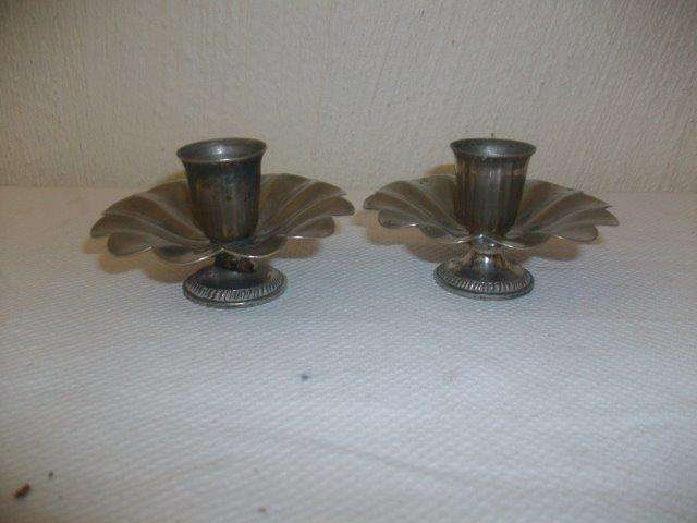a pair of small sliver plated candle sticks