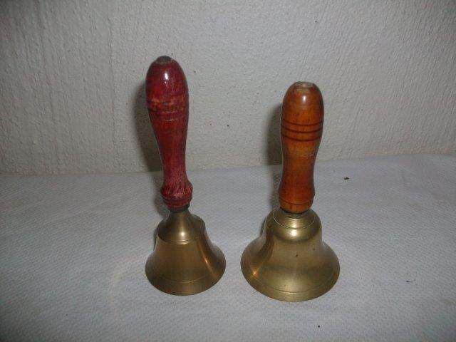 Two wooden handled brass bells