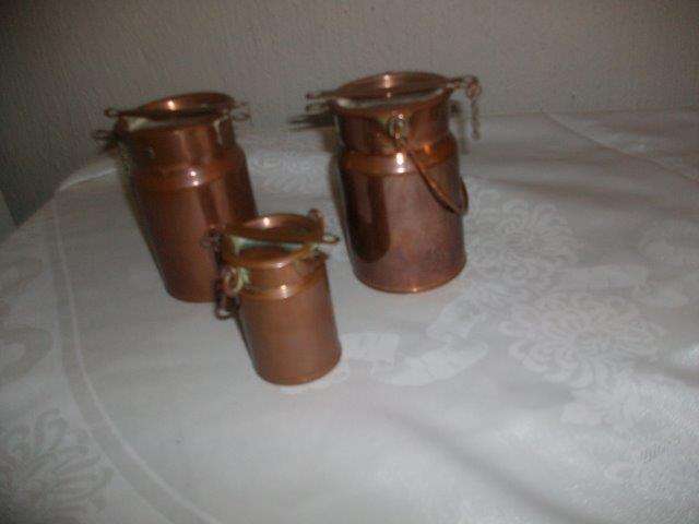 Three small ornamental copper milk cans