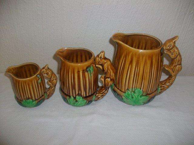 A set of three vintage squirrel jugs