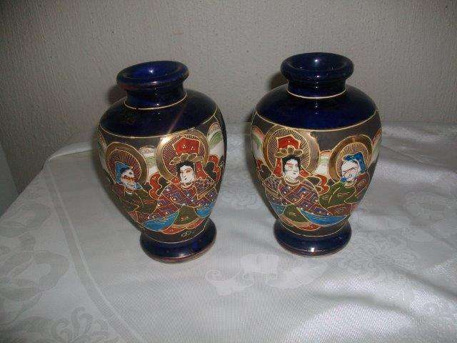 A pair of vintage ceramic hand painted Chinese vases