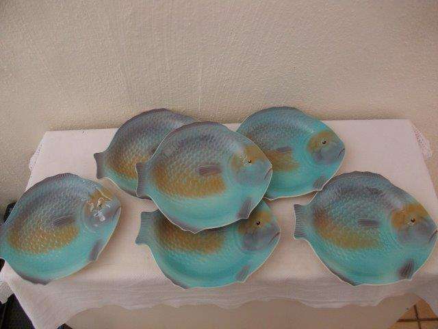 A set of lovely shorter and son fish plates