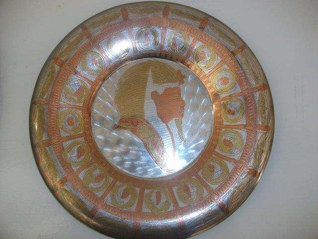 Lovely two toned brass and copper wall plate with a eyepation style