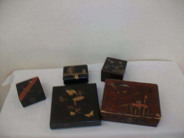 A collection of some wooden trinket boxes for one bid