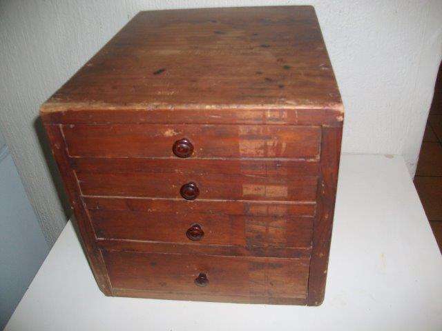 Wooden chest of small drawers used for storing stationery items