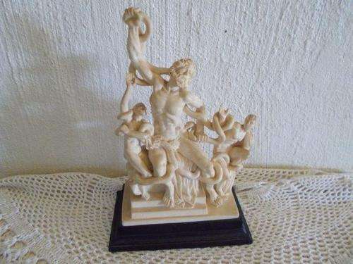 Lovely resin statue on wooden base