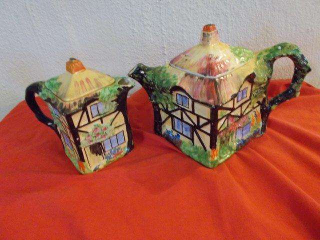 A pair of lovely vintage grimwades cottage style tea pots