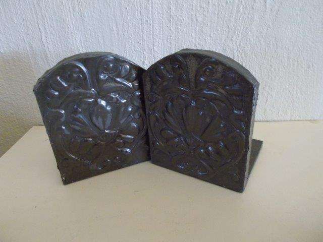 A pair of vintage pewter bookends