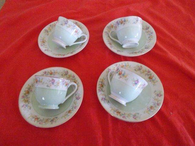 A set of four small coffee cups