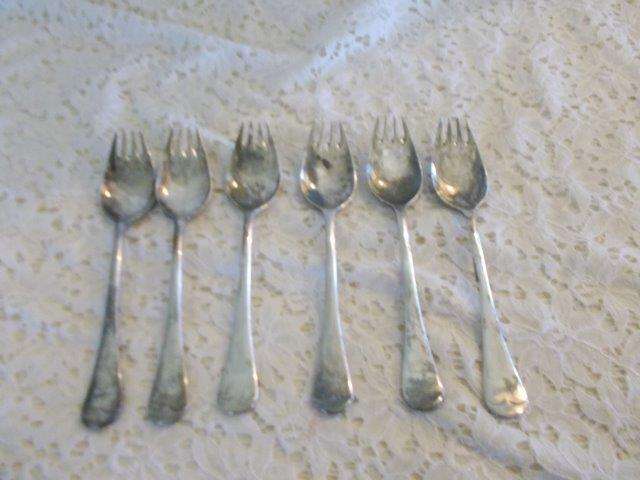 A set of six vintage sliver plated sporks forks