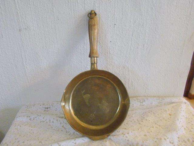Sold heavy brass pan wall hanging with wooden handle