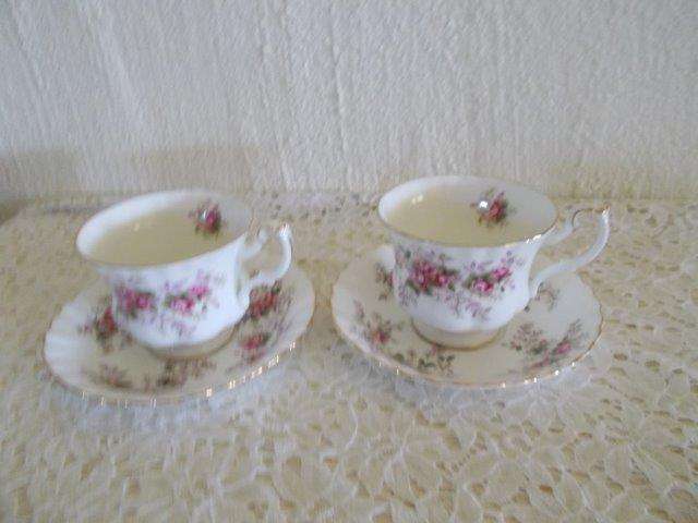 A pair of royal albert lavender rose duos tea cups