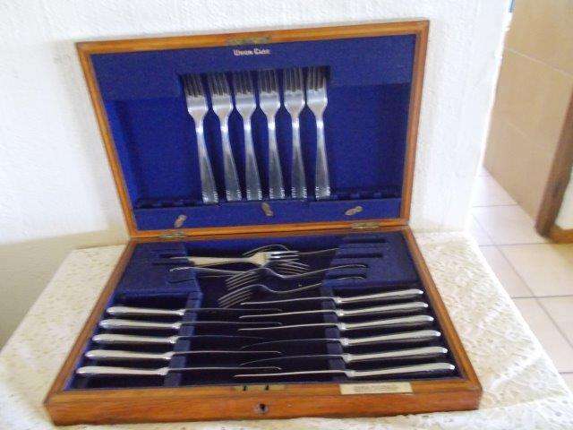 Nice wooden canteen set with incomplete set of stainless steel cutlery items